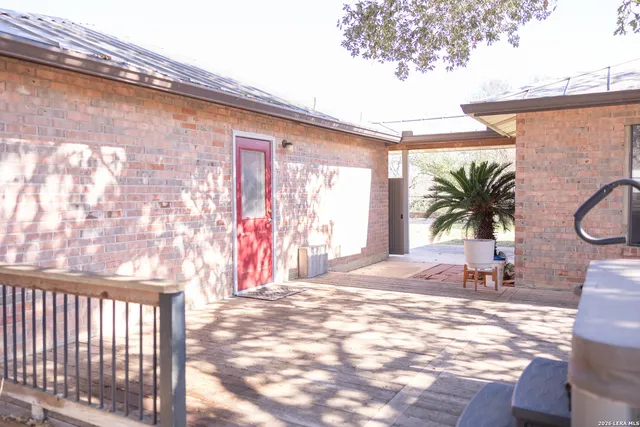 a view of a backyard with a patio