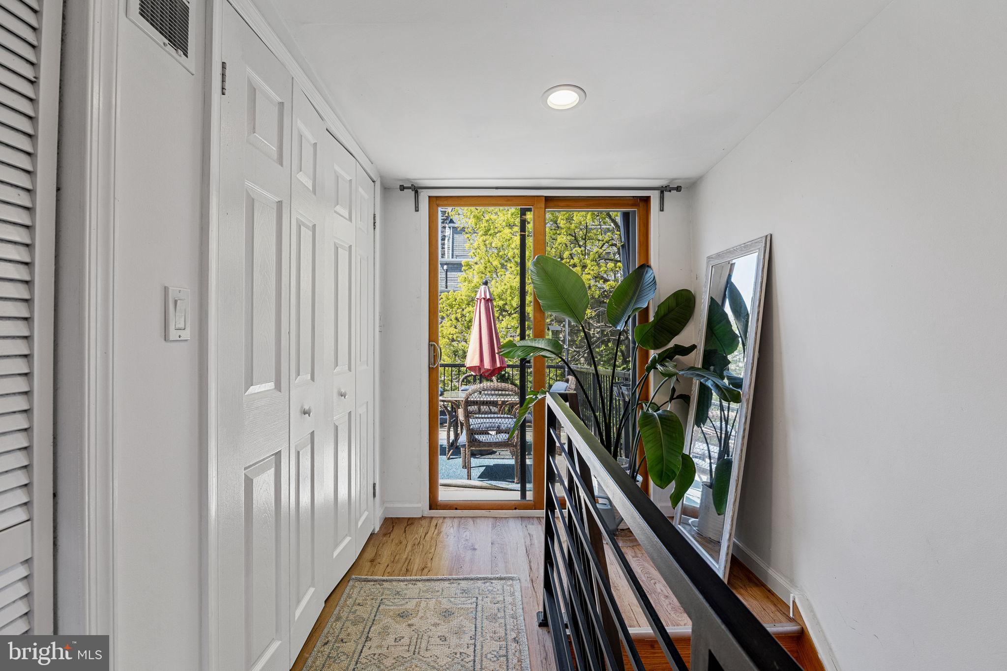 744 South 19th Street Philadelphia, PA 19146 - Photo 11 of 29 a view of a hallway with wooden floor and stairs