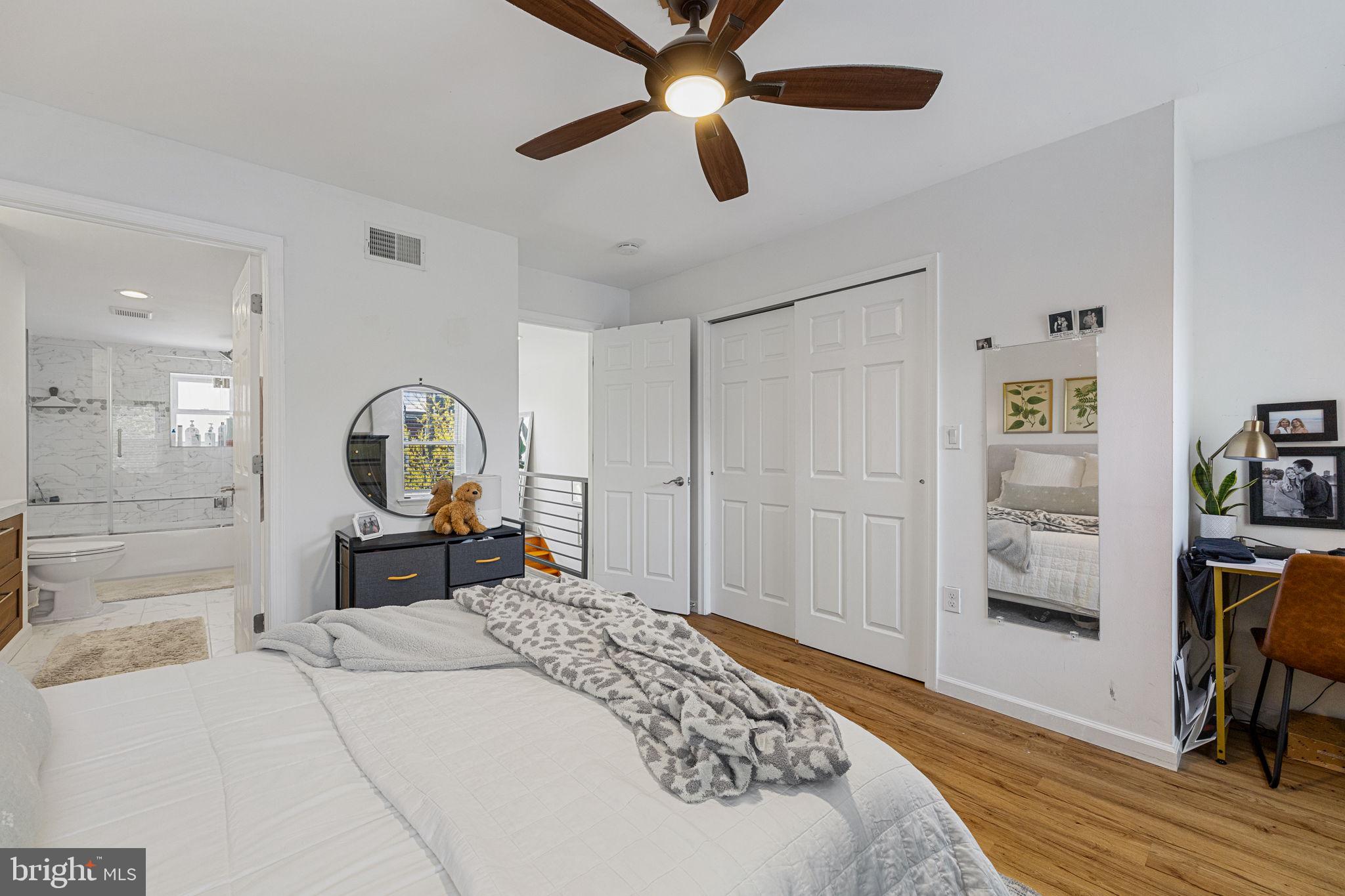 744 South 19th Street Philadelphia, PA 19146 - Photo 16 of 29 a bedroom with a bed a dresser and chair