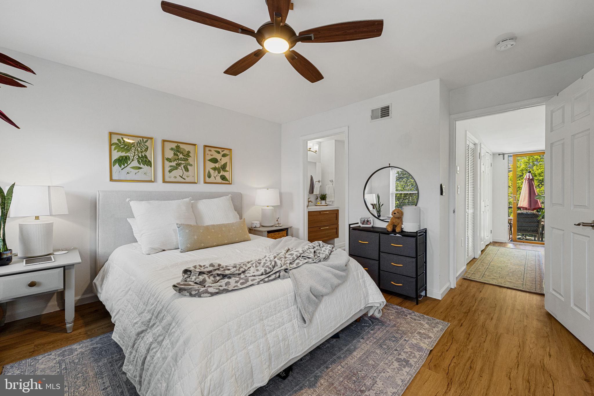744 South 19th Street Philadelphia, PA 19146 - Photo 17 of 29 a bedroom with a bed and wooden floor