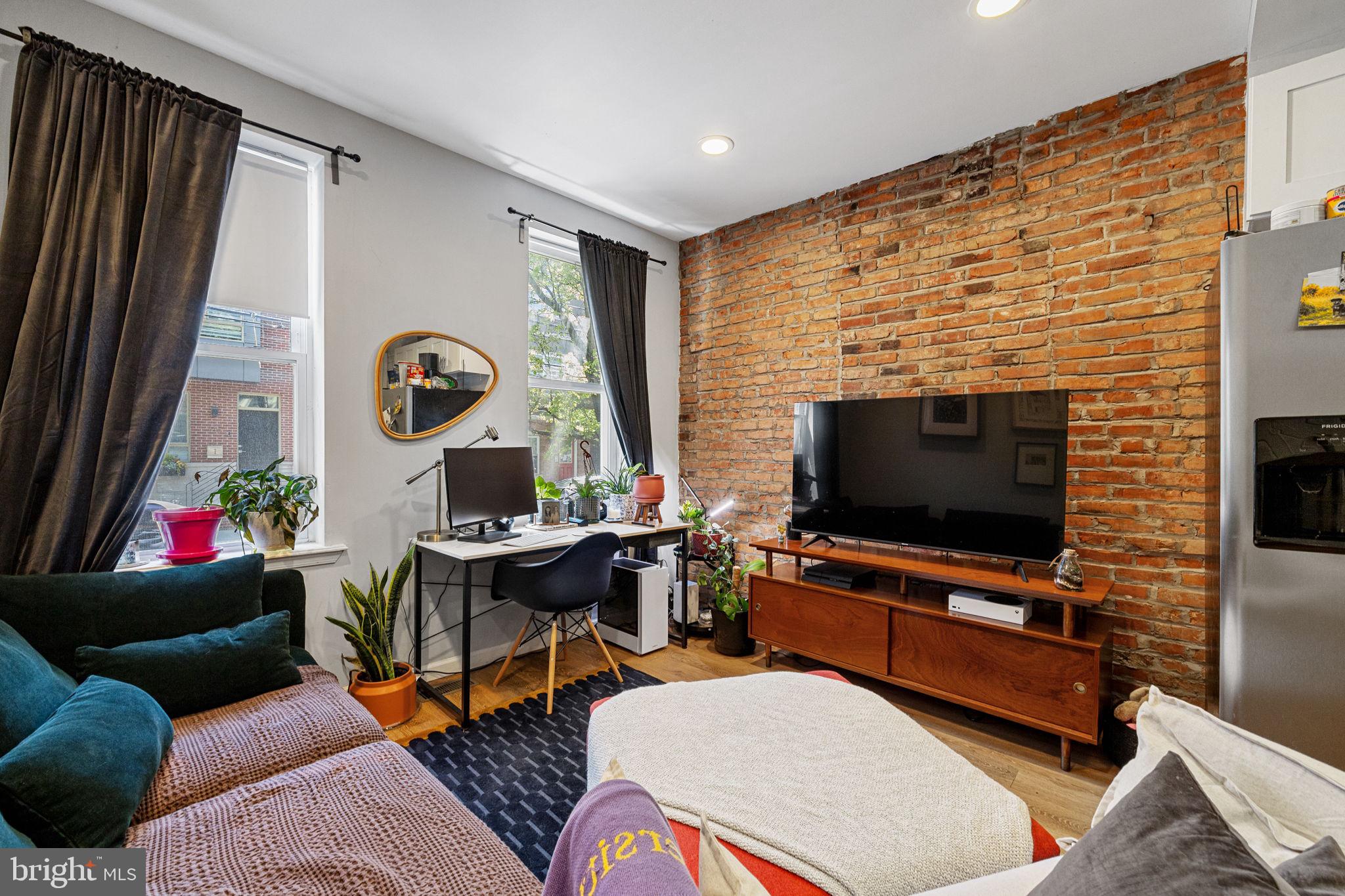 744 South 19th Street Philadelphia, PA 19146 - Photo 19 of 29 a living room with furniture and a flat screen tv