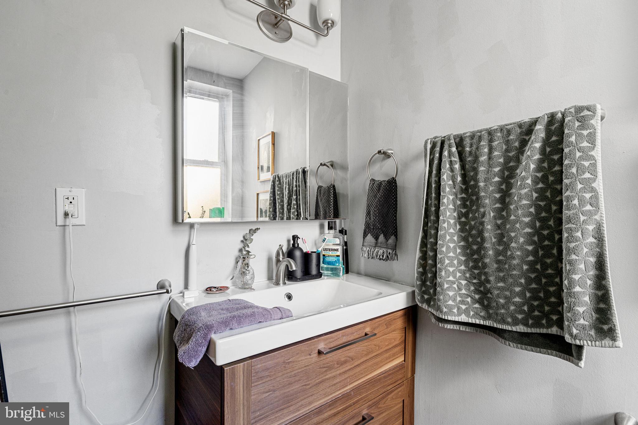 744 South 19th Street Philadelphia, PA 19146 - Photo 23 of 29 a bathroom with a sink and a mirror
