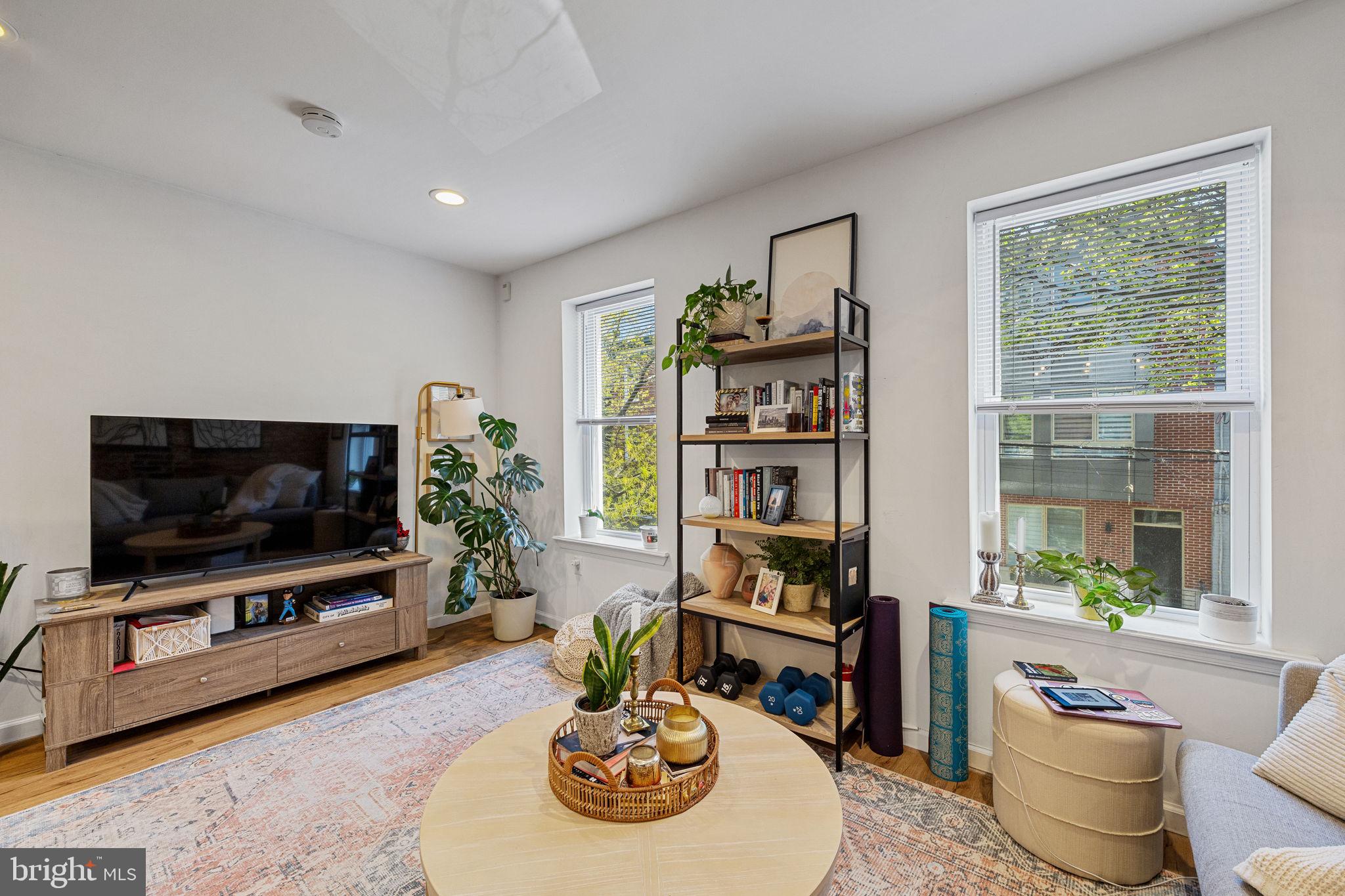 744 South 19th Street Philadelphia, PA 19146 - Photo 4 of 29 a living room with furniture and a flat screen tv