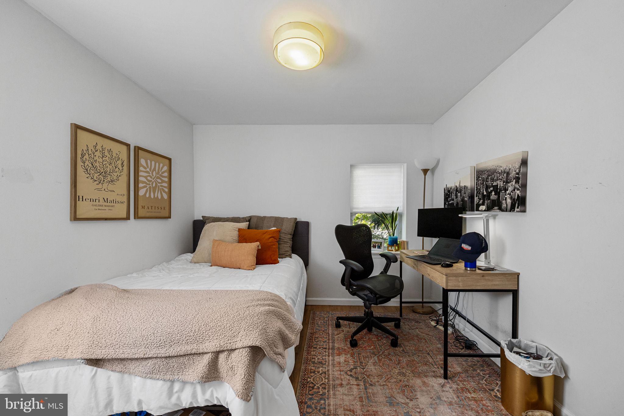 744 South 19th Street Philadelphia, PA 19146 - Photo 8 of 29 a bedroom with a bed a desk and chair
