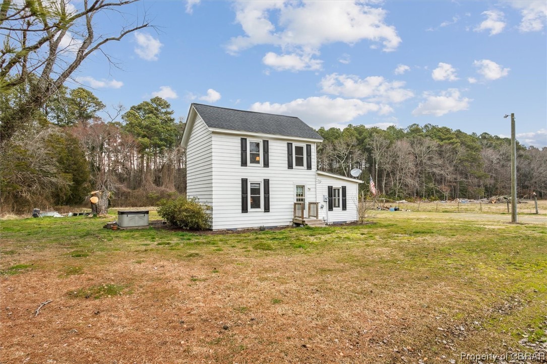 299 Greene Road Mathews, VA 23109 - Photo 2 of 40 a view of a house with a yard