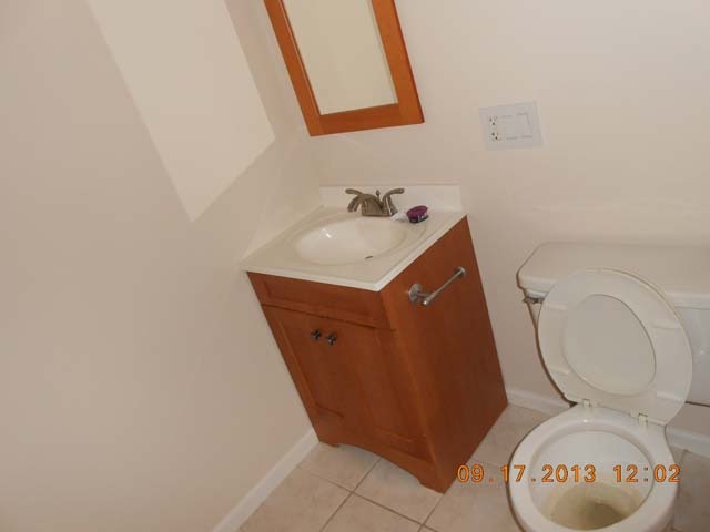 18 East Old Willow Road, Unit 106N Prospect Heights, IL 60070 - Photo 11 of 12 a bathroom with a toilet and a sink