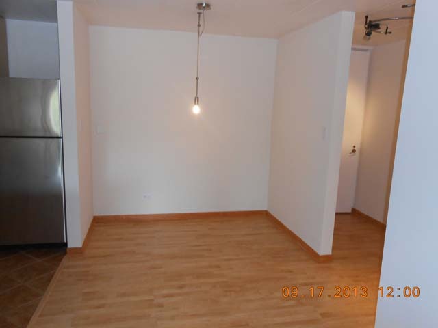 18 East Old Willow Road, Unit 106N Prospect Heights, IL 60070 - Photo 3 of 12 a view of an empty room with wooden floor and a ceiling fan