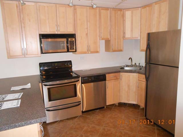 18 East Old Willow Road, Unit 106N Prospect Heights, IL 60070 - Photo 4 of 12 a kitchen with a refrigerator sink and microwave