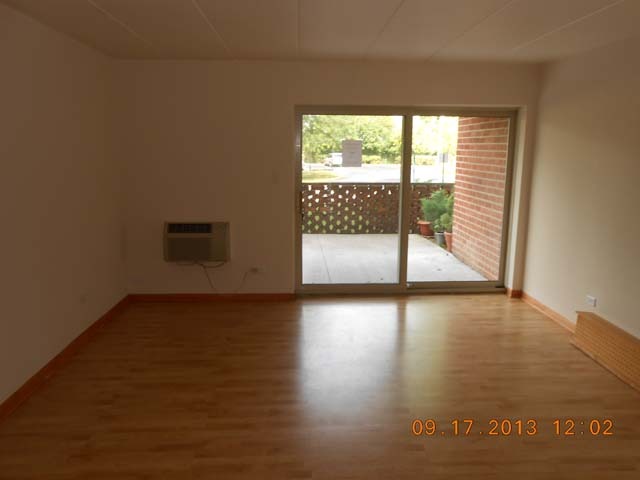 18 East Old Willow Road, Unit 106N Prospect Heights, IL 60070 - Photo 5 of 12 a view of a livingroom with wooden floor