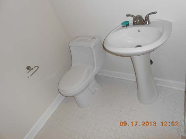 18 East Old Willow Road, Unit 106N Prospect Heights, IL 60070 - Photo 6 of 12 a bathroom with a sink toilet and a mirror