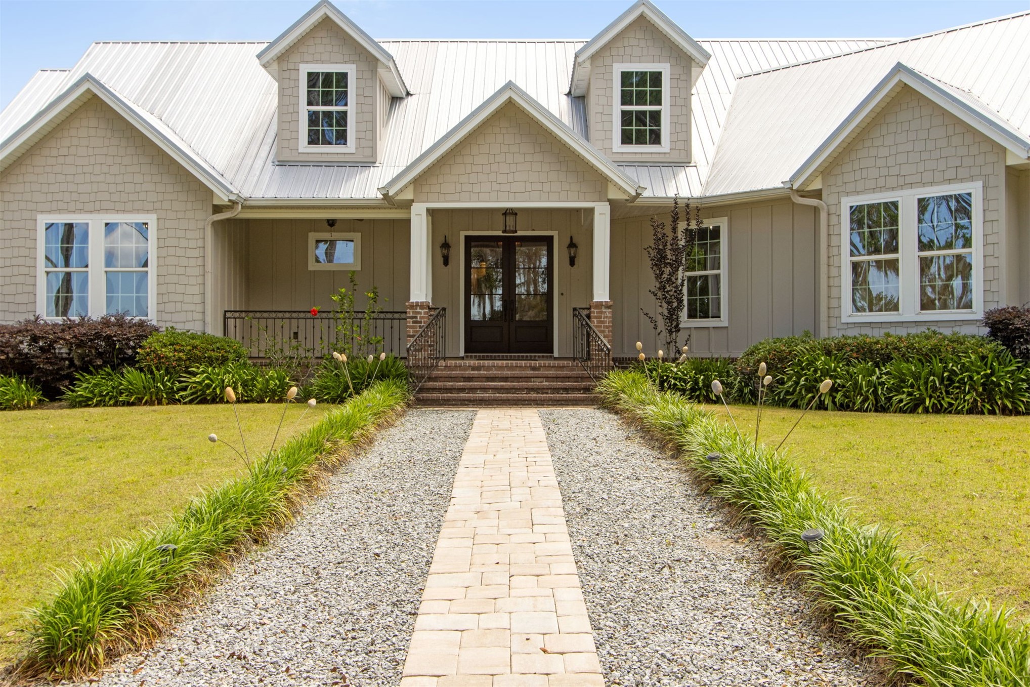 a front view of a house with a yard