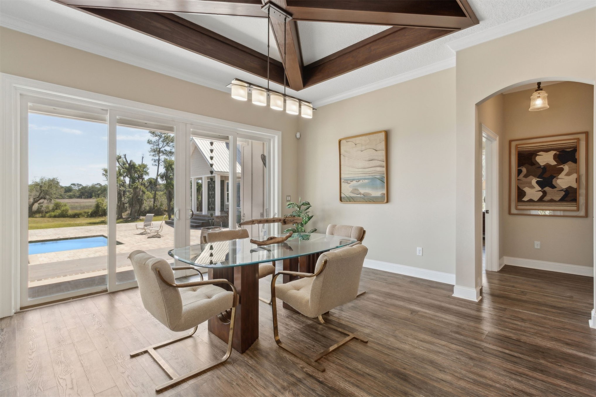 1900 Sycamore Lane Fernandina Beach, FL 32034 - Photo 12 of 54 a view of a dining room with furniture large window and wooden floor