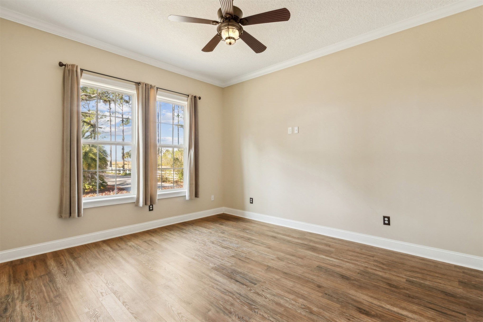 1900 Sycamore Lane Fernandina Beach, FL 32034 - Photo 20 of 54 a view of empty room with wooden floor and fan