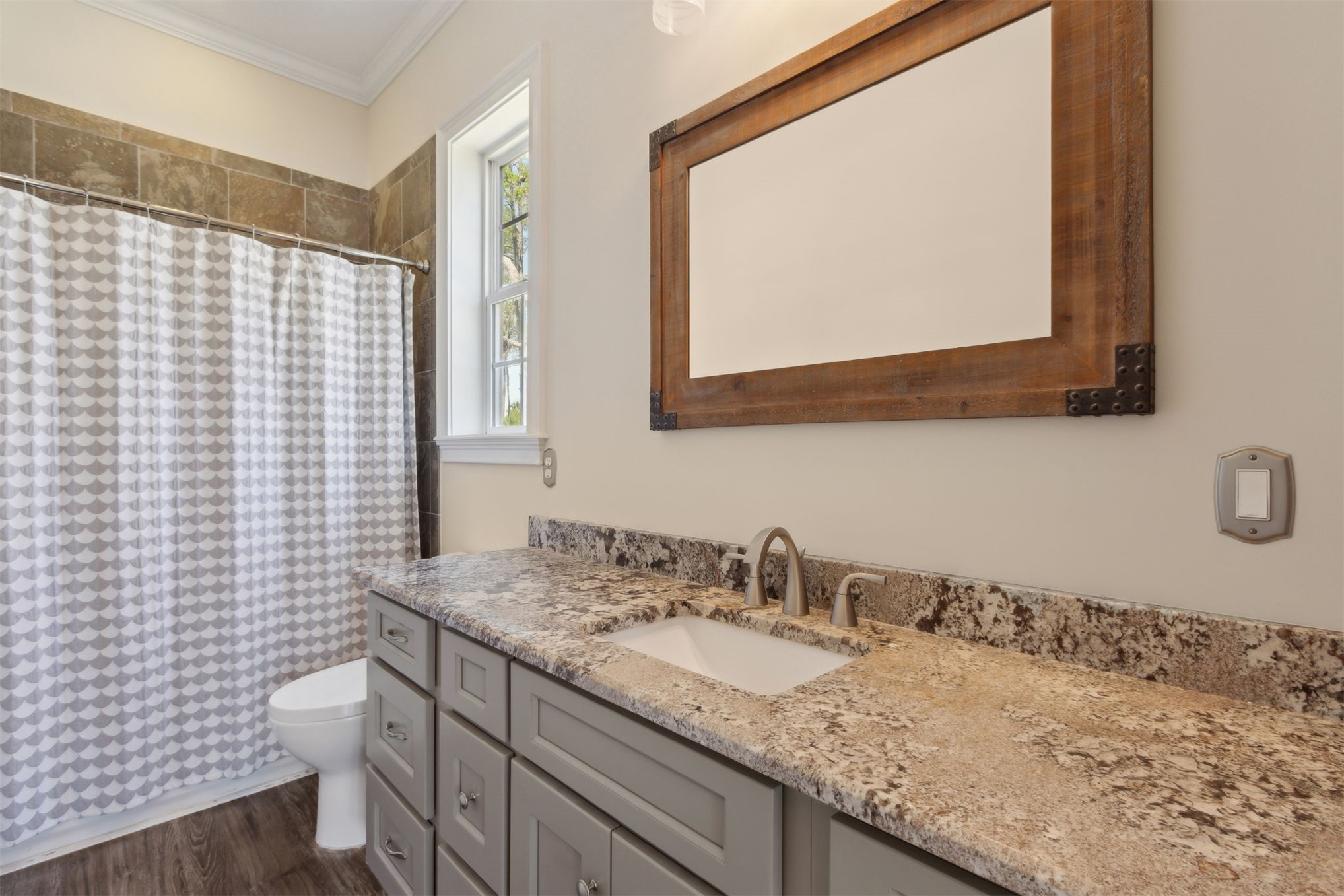 1900 Sycamore Lane Fernandina Beach, FL 32034 - Photo 24 of 54 a bathroom with a granite countertop sink toilet and mirror
