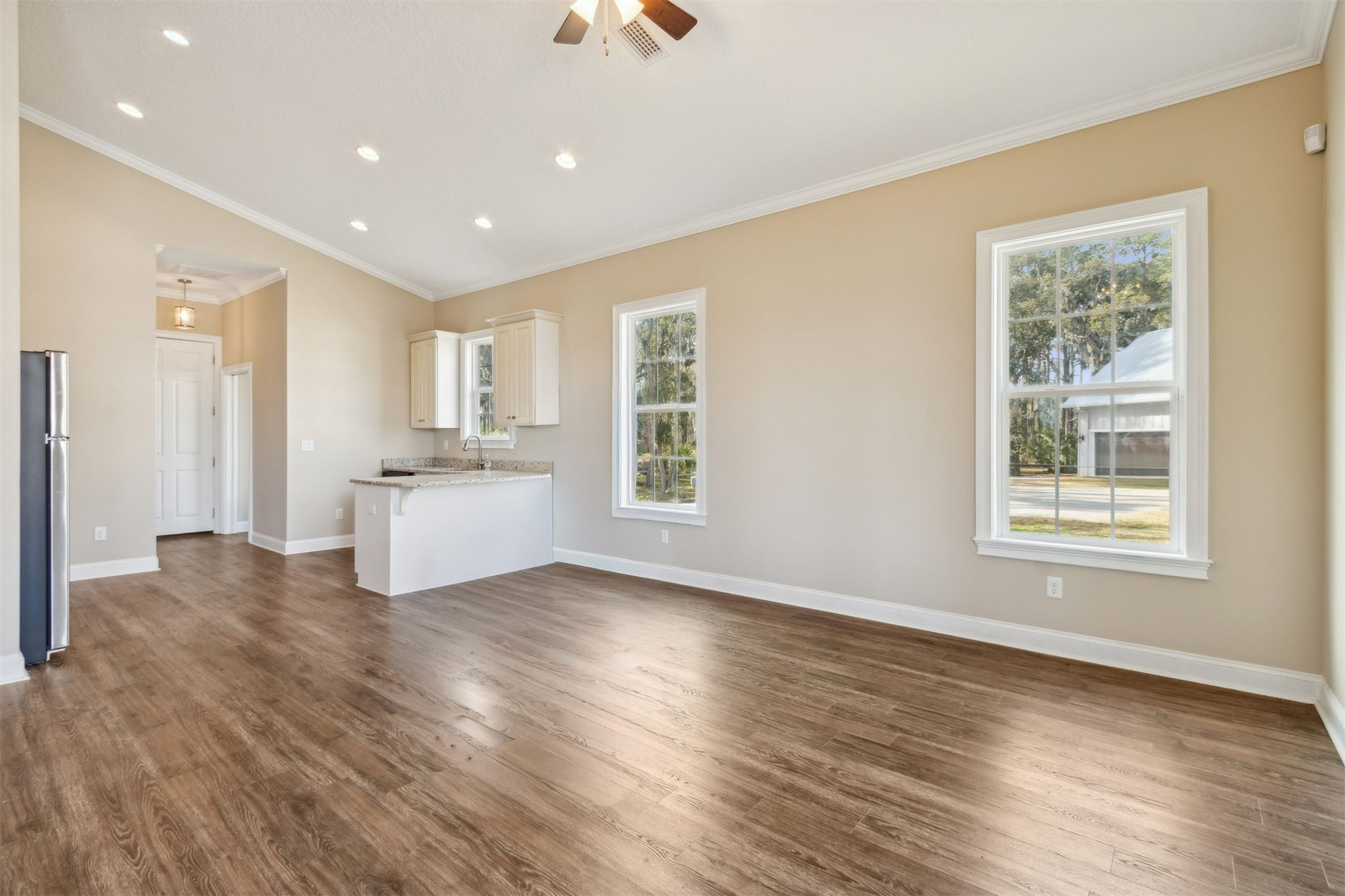 1900 Sycamore Lane Fernandina Beach, FL 32034 - Photo 32 of 54 a view of a kitchen with wooden floor and windows