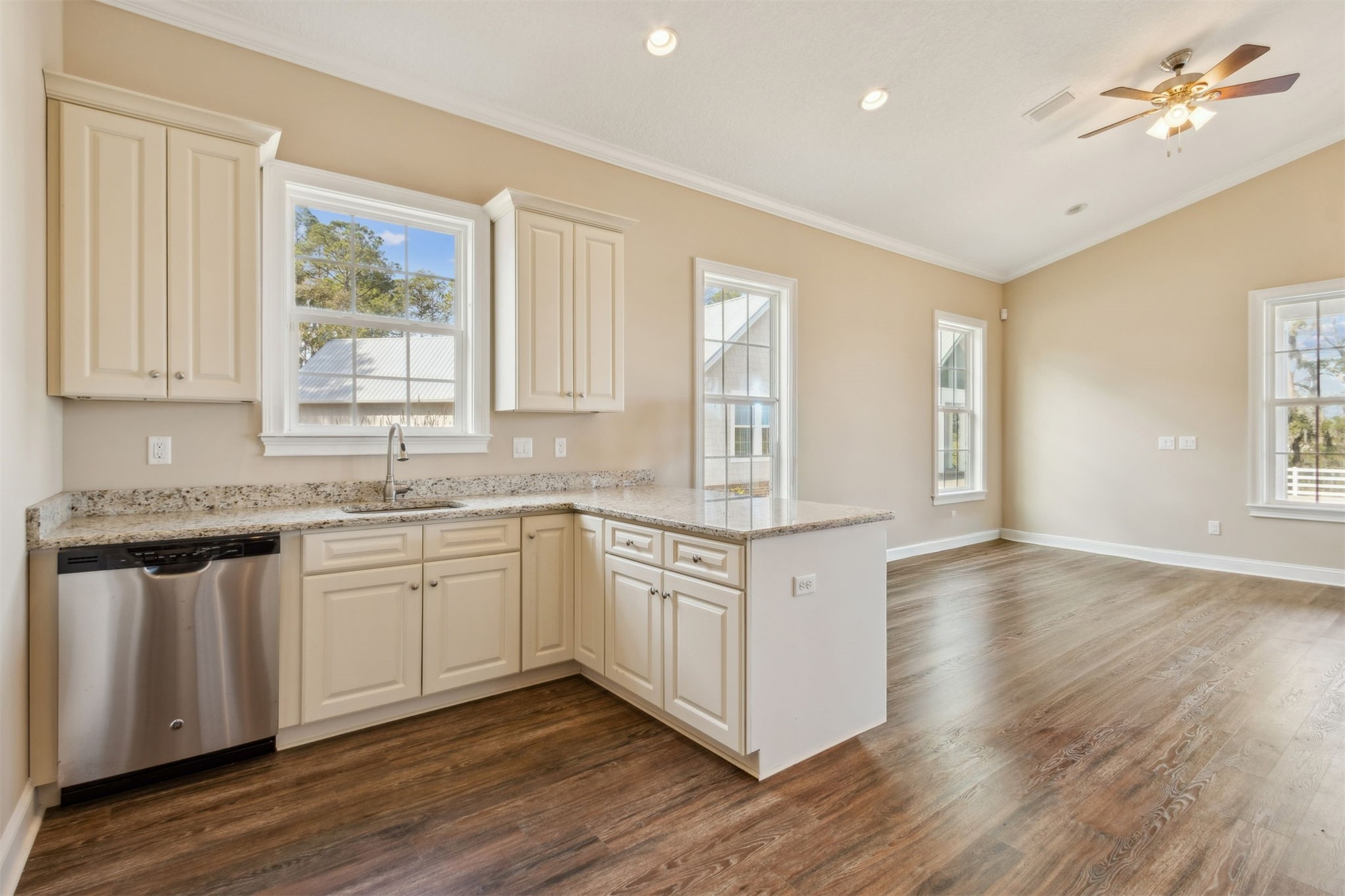 1900 Sycamore Lane Fernandina Beach, FL 32034 - Photo 33 of 54 a kitchen with granite countertop white cabinets and white appliances