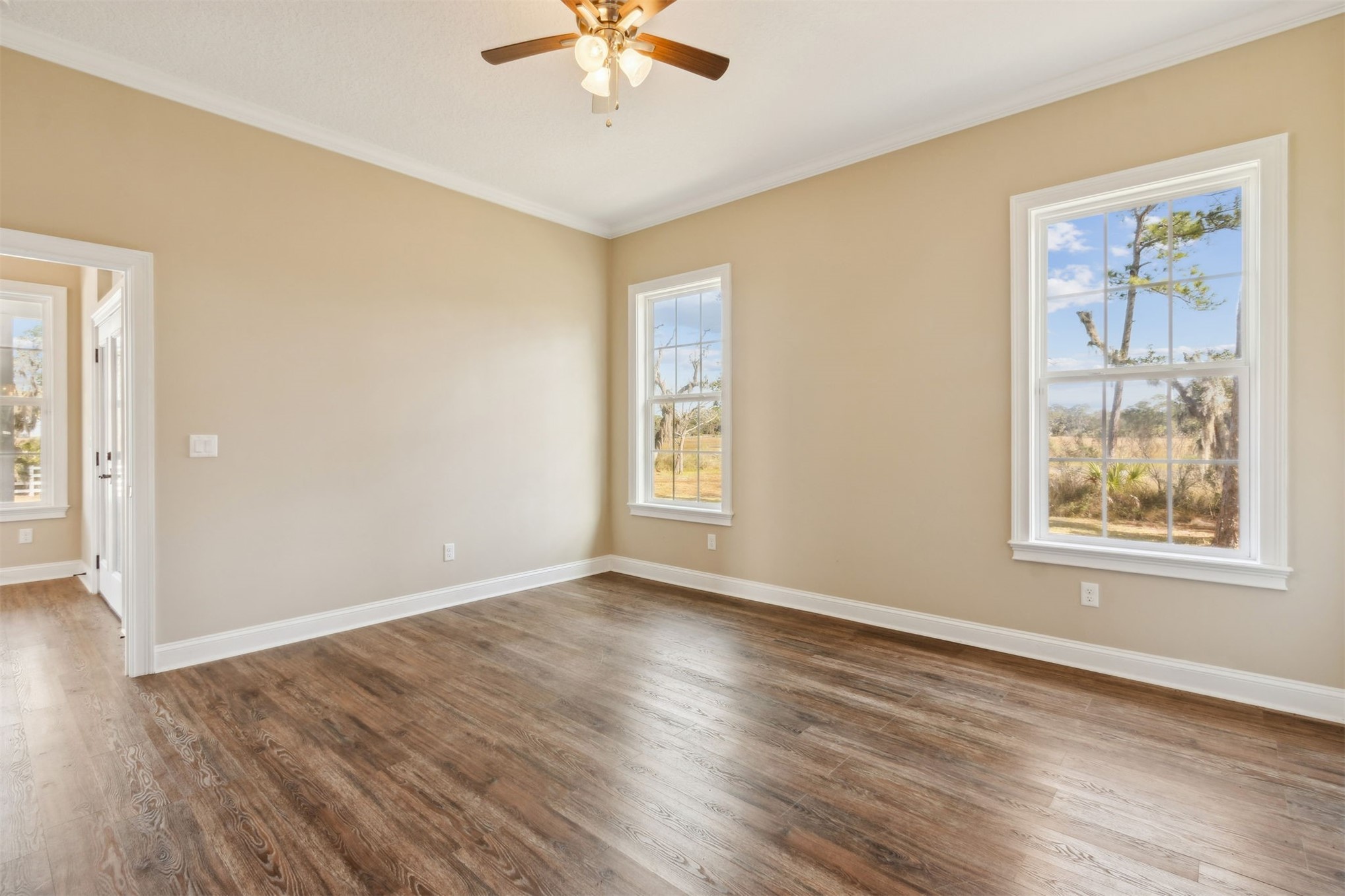 1900 Sycamore Lane Fernandina Beach, FL 32034 - Photo 36 of 54 a view of an empty room with wooden floor and a window