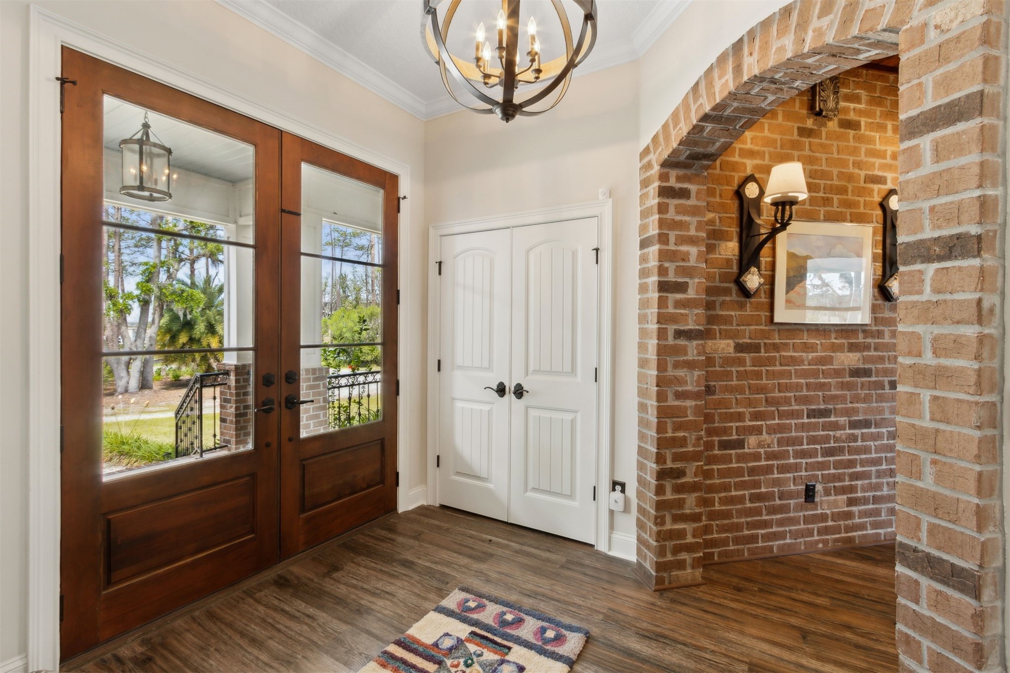1900 Sycamore Lane Fernandina Beach, FL 32034 - Photo 5 of 54 a view of a hallway with wooden floor and a glass door