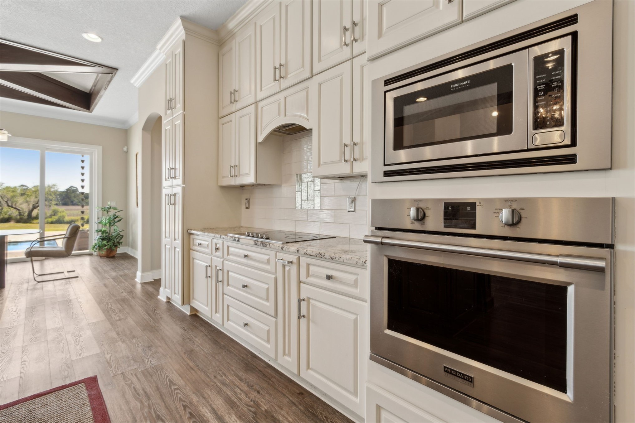 1900 Sycamore Lane Fernandina Beach, FL 32034 - Photo 10 of 54 a kitchen with stainless steel appliances granite countertop a stove microwave and cabinets