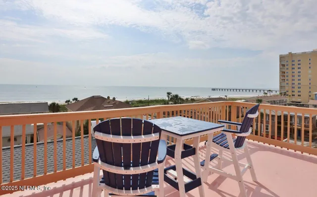 a view of a swimming pool with seating space