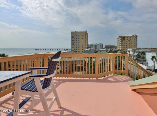 a view of a balcony with chairs