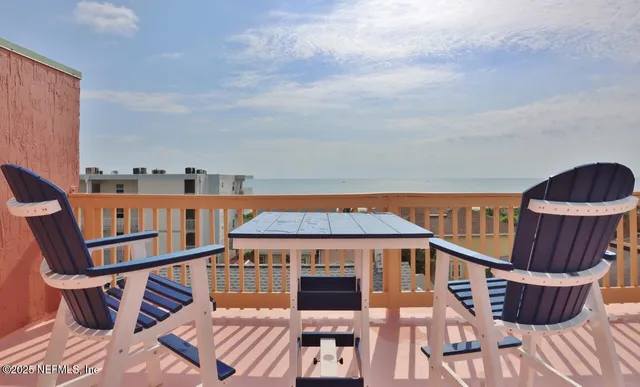 a view of balcony with furniture