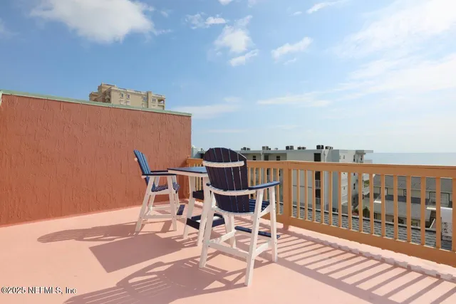 a view of a balcony with chair