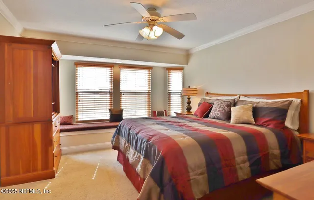 a bedroom with bed and window