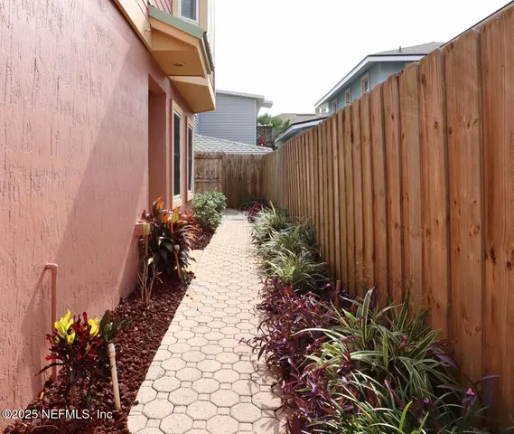 a view of a backyard with chairs