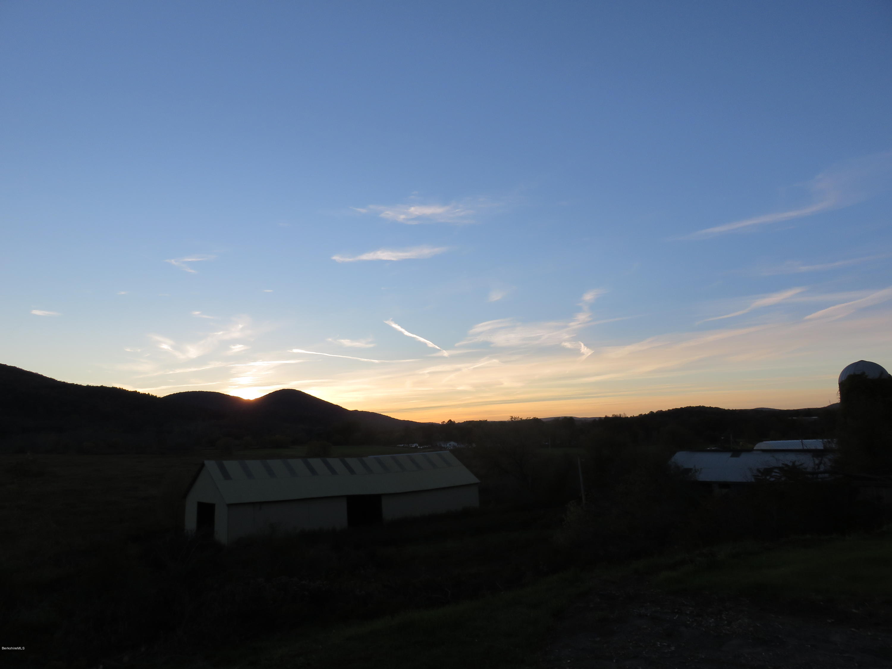 800 Tyringham Road Lee, MA 01238 - Photo 3 of 19 a view of a city with sunset view
