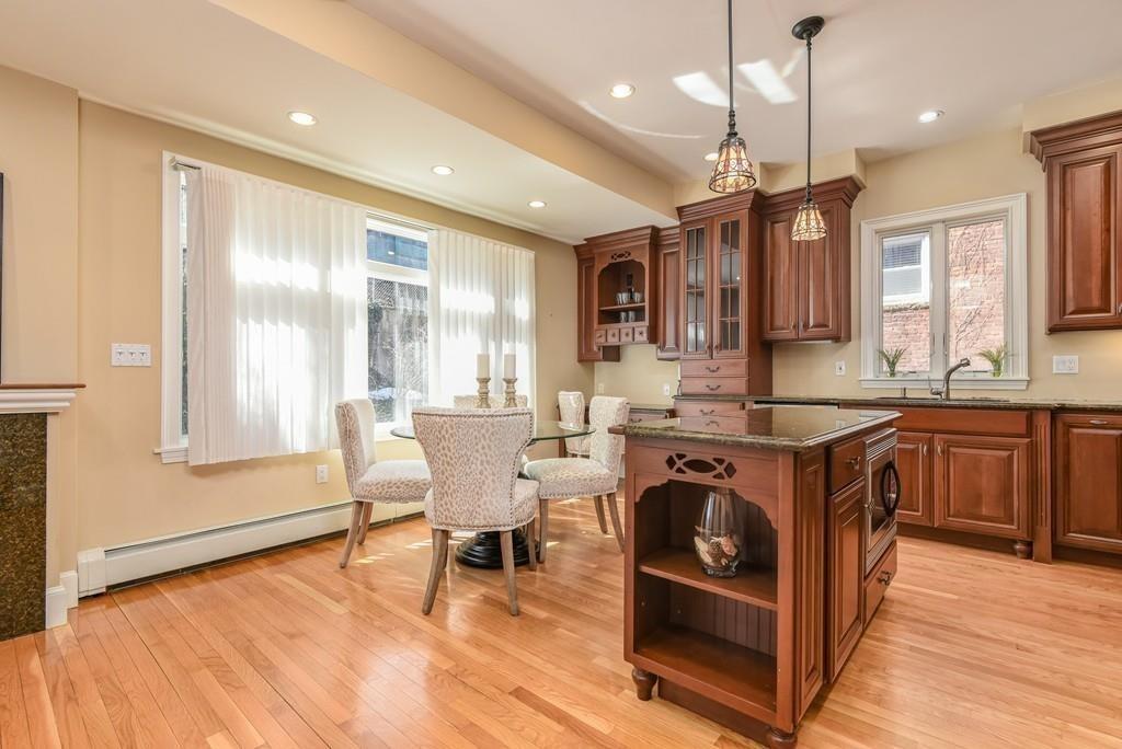 41 University Road Brookline, MA 02445 - Photo 17 of 37 a kitchen with a stove a sink and a refrigerator