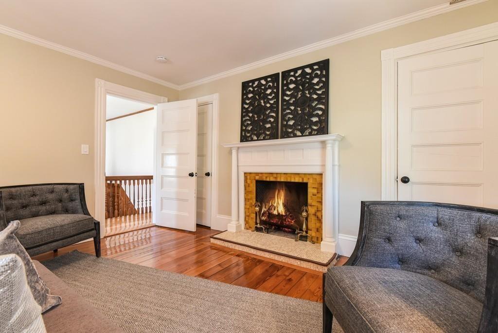 41 University Road Brookline, MA 02445 - Photo 19 of 37 a living room with furniture and a fireplace