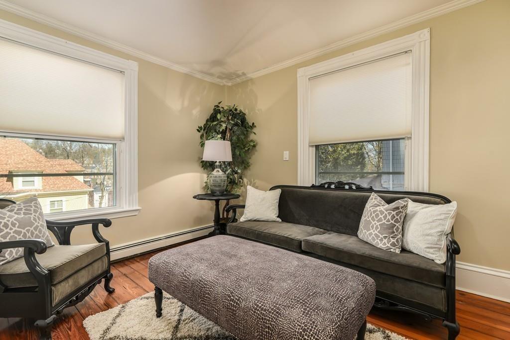 41 University Road Brookline, MA 02445 - Photo 22 of 37 a living room with furniture and a window