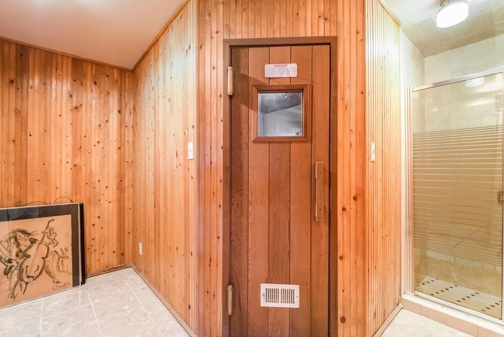 41 University Road Brookline, MA 02445 - Photo 29 of 37 a view of a bathroom with a shower and a mirror