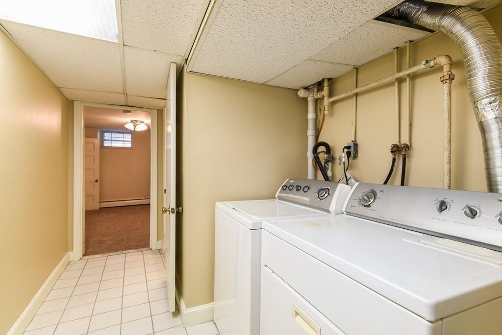 41 University Road Brookline, MA 02445 - Photo 34 of 37 a bathroom with a sink and a mirror