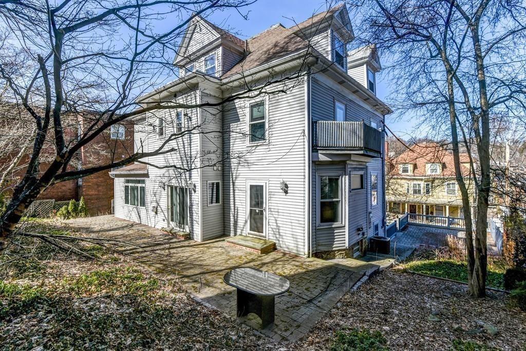 41 University Road Brookline, MA 02445 - Photo 37 of 37 a front view of a house with a yard