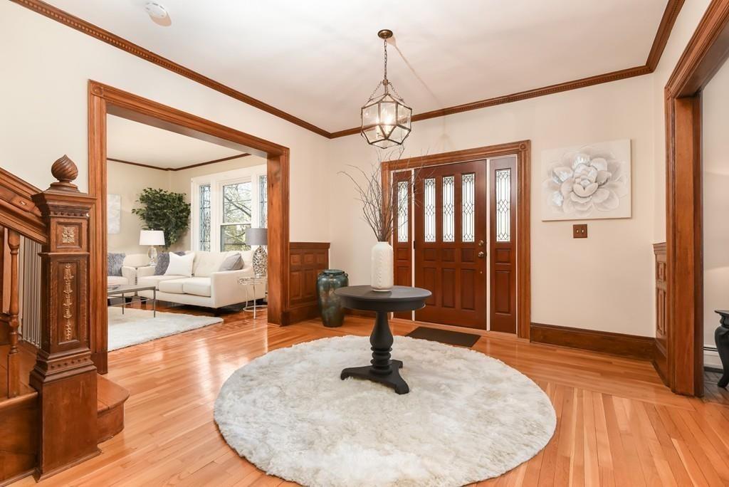 41 University Road Brookline, MA 02445 - Photo 4 of 37 a living room with furniture and a chandelier