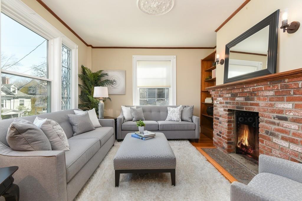 41 University Road Brookline, MA 02445 - Photo 5 of 37 a living room with furniture and a fireplace