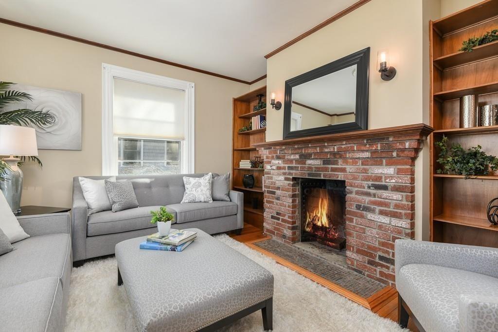 41 University Road Brookline, MA 02445 - Photo 6 of 37 a living room with furniture and a fireplace