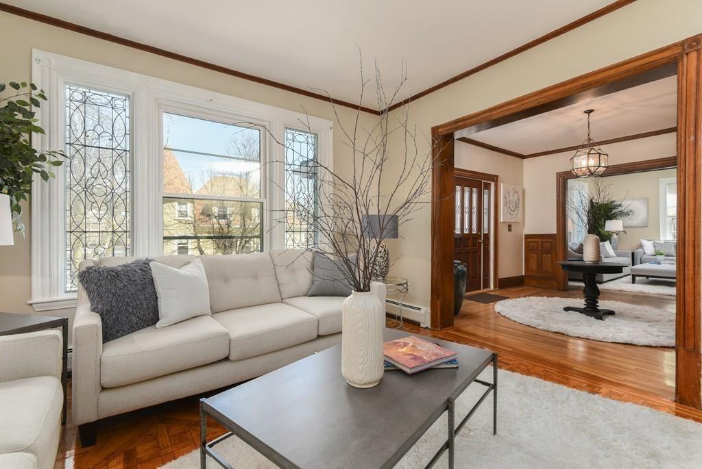 41 University Road Brookline, MA 02445 - Photo 7 of 37 a living room with furniture and a large window
