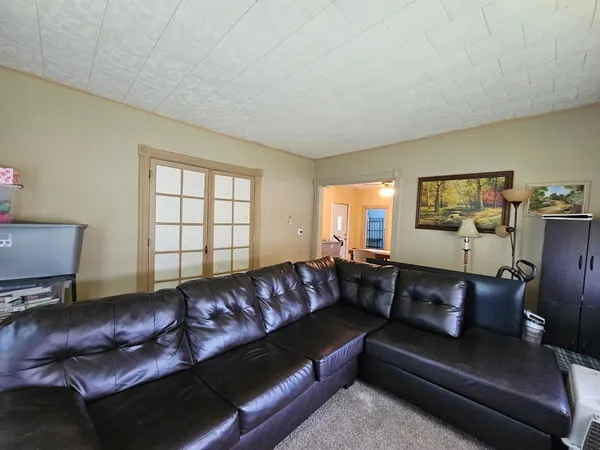 a living room with a couch and a window