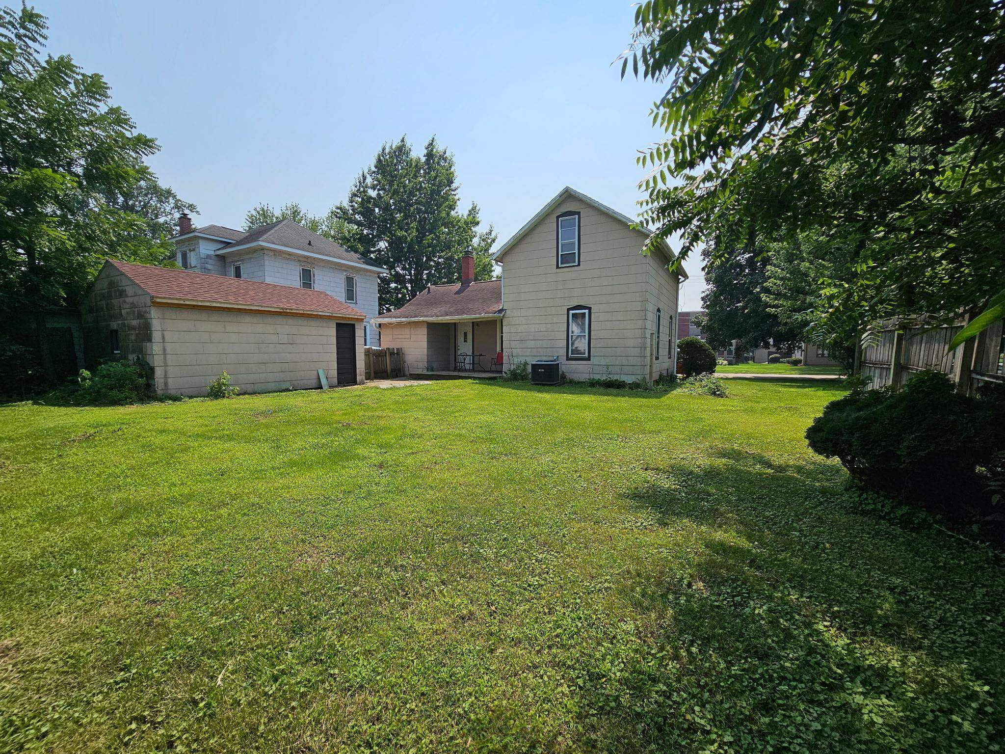 302 East Park Street Morrison, IL 61270 - Photo 9 of 10 a view of a house with a yard and a large tree