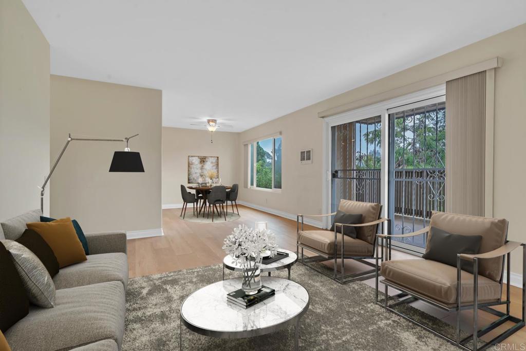 8636 Via Mallorca, Unit A La Jolla, CA 92037 - Photo 1 of 21 a living room with furniture and a large window