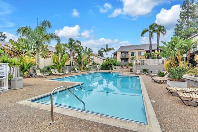 a view of a swimming pool with a patio
