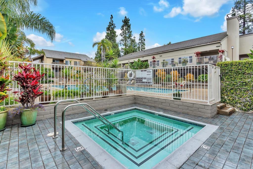 8636 Via Mallorca, Unit A La Jolla, CA 92037 - Photo 15 of 21 a view of a house with a swimming pool and sitting area