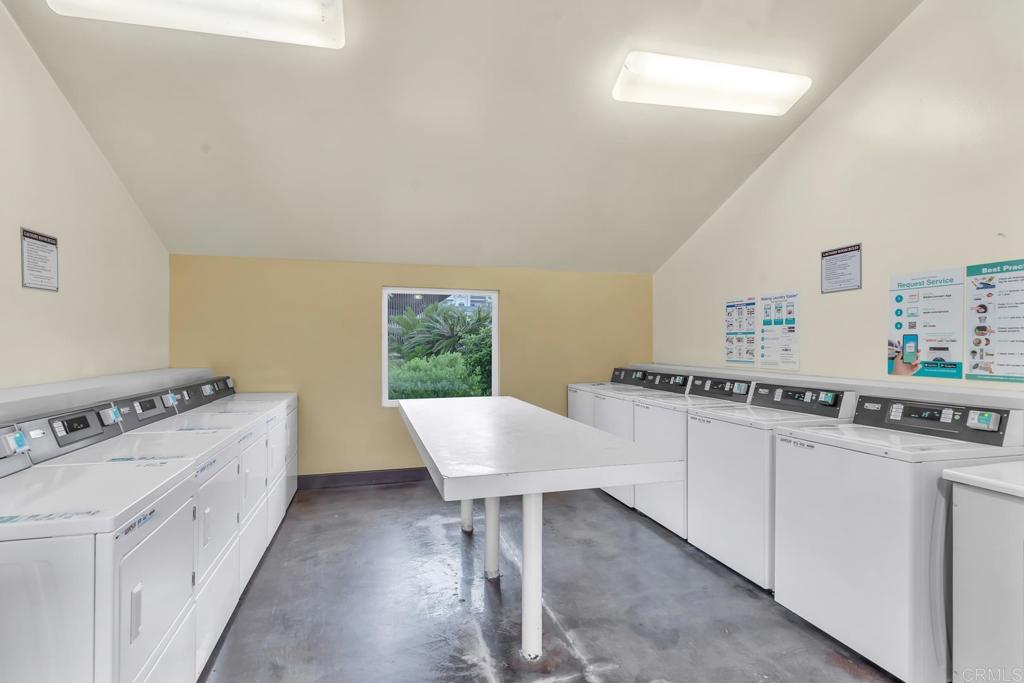 8636 Via Mallorca, Unit A La Jolla, CA 92037 - Photo 20 of 21 a kitchen with stainless steel appliances granite countertop a stove a sink and a refrigerator