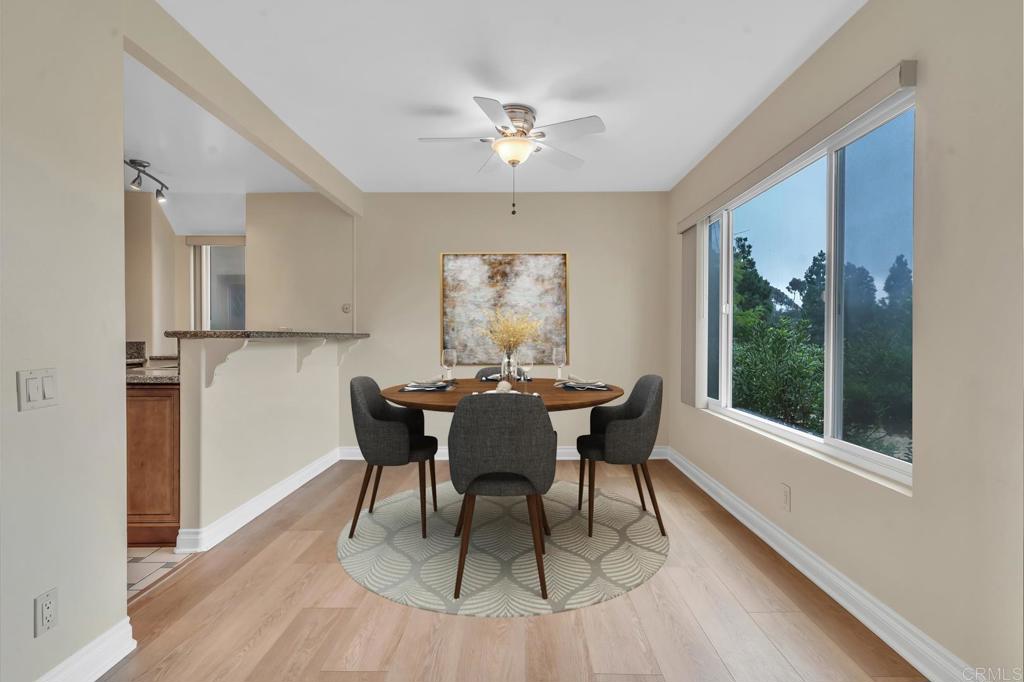 8636 Via Mallorca, Unit A La Jolla, CA 92037 - Photo 4 of 21 a dining room with furniture a window and a table
