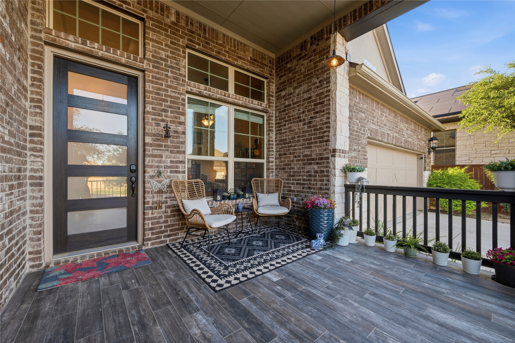 138 Rpd Spgs Cove Georgetown, TX 78628 - Photo 3 of 37 a view of a deck with wooden floor and floor to ceiling window
