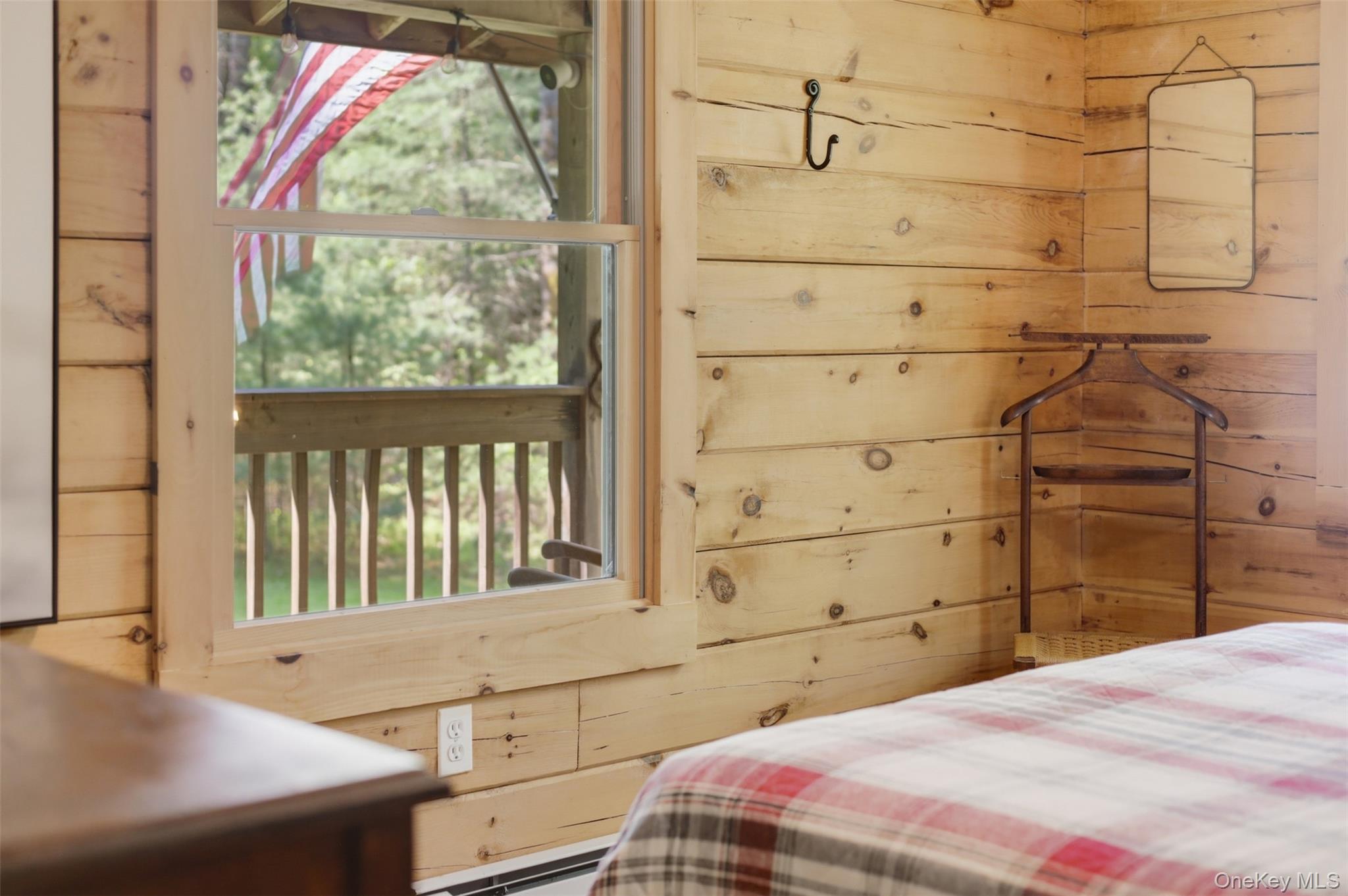 301 Pucky Huddle Road Bethel, NY 12720 - Photo 23 of 39 Bedroom with large windows looking out to the porch