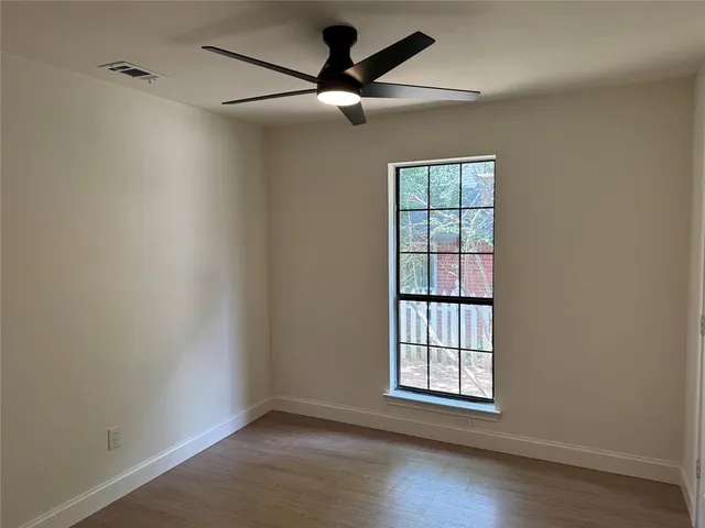 an empty room with closet area